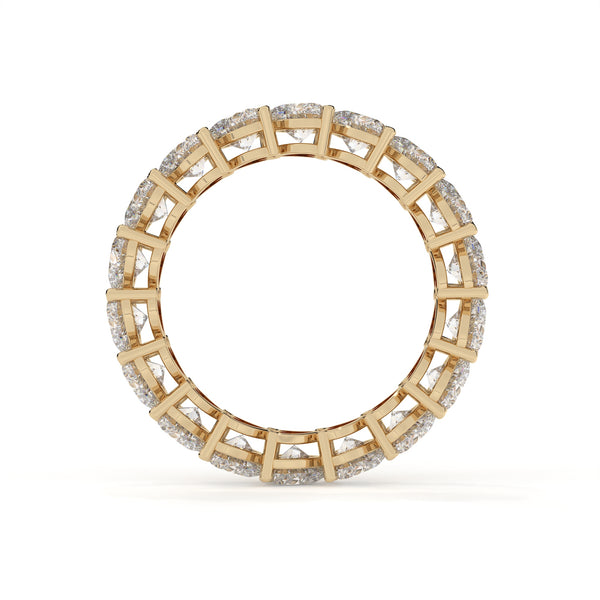 Gold ring with diamond accents on a white background