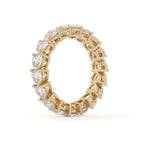 Gold ring with diamond accents on a white background