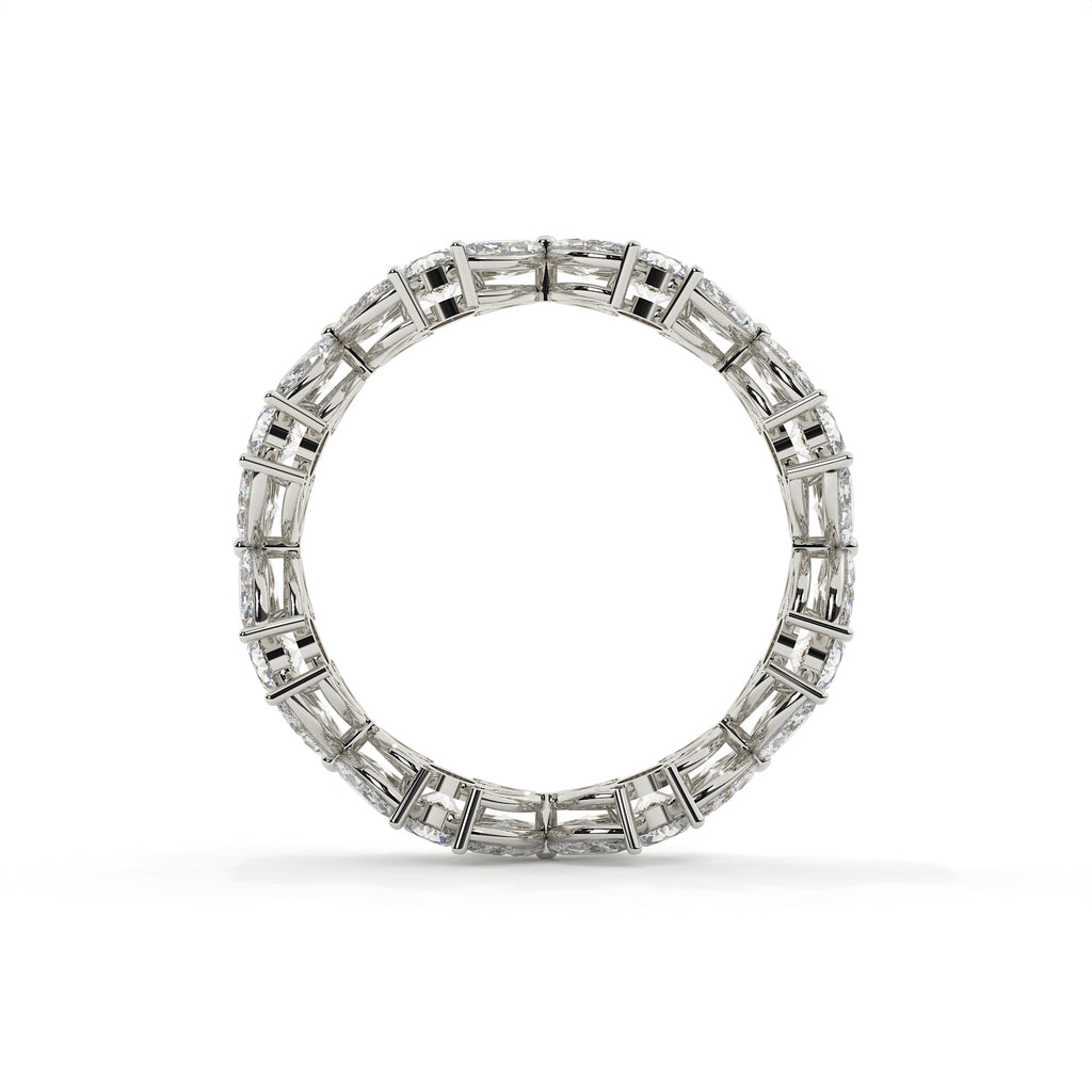 Diamond ring with baguette and round cut stones on a white background