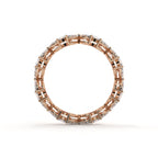 Rose gold ring with diamond accents on a white background