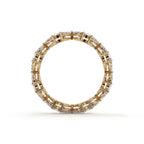 Gold ring with diamond accents on a white background