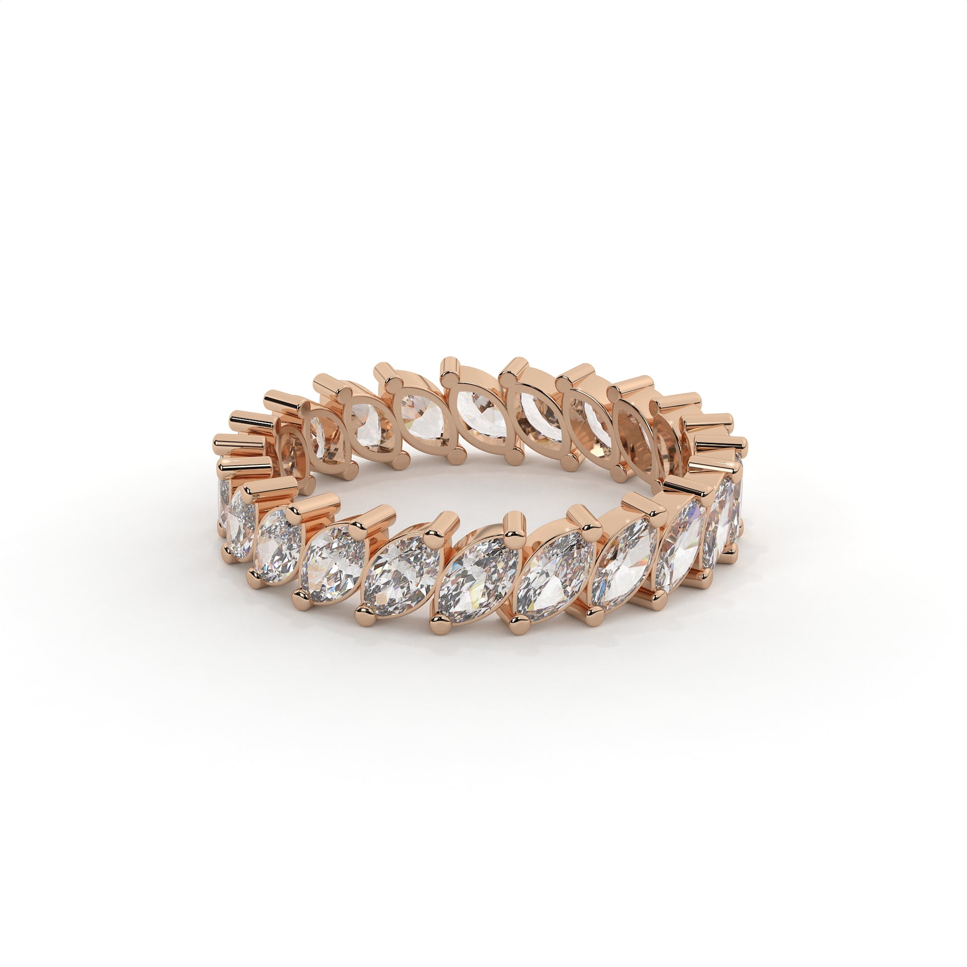 Rose gold ring with clear gemstones on a white background