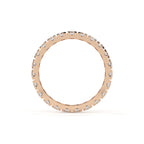 Rose gold ring with small diamonds on a white background