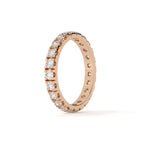 Rose gold ring with diamonds on a white background