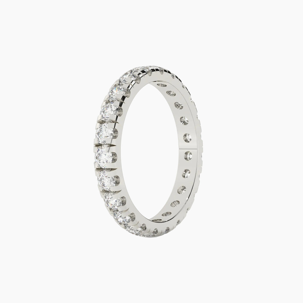 Silver ring with embedded diamonds on a white background
