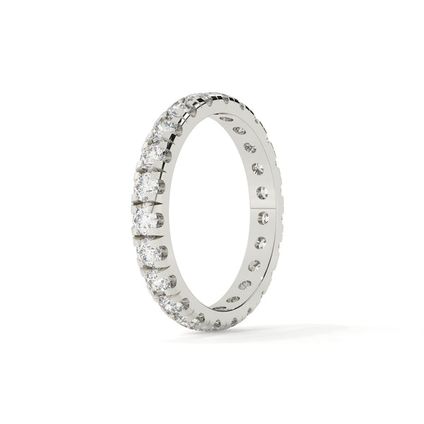 Silver ring with embedded diamonds on a white background