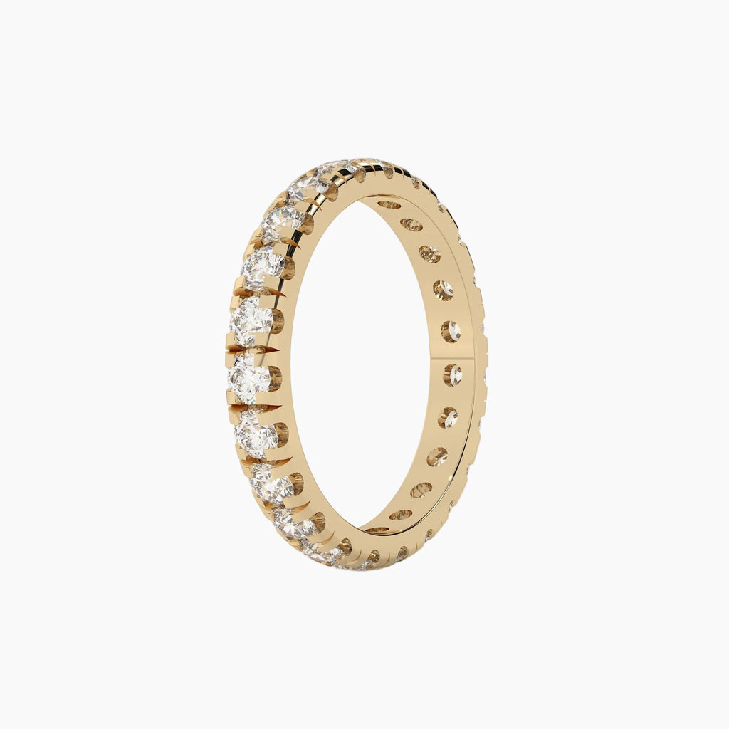 Gold ring with diamonds on a white background