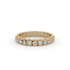 Gold ring with diamonds on a white background