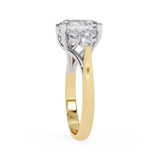 Two-tone gold ring with a diamond on a white background