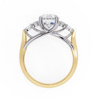 Two-tone gold and silver ring with a diamond on a white background
