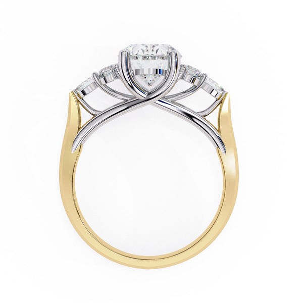 Two-tone gold and silver ring with a diamond on a white background