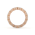 Rose gold ring with a lattice design on a white background