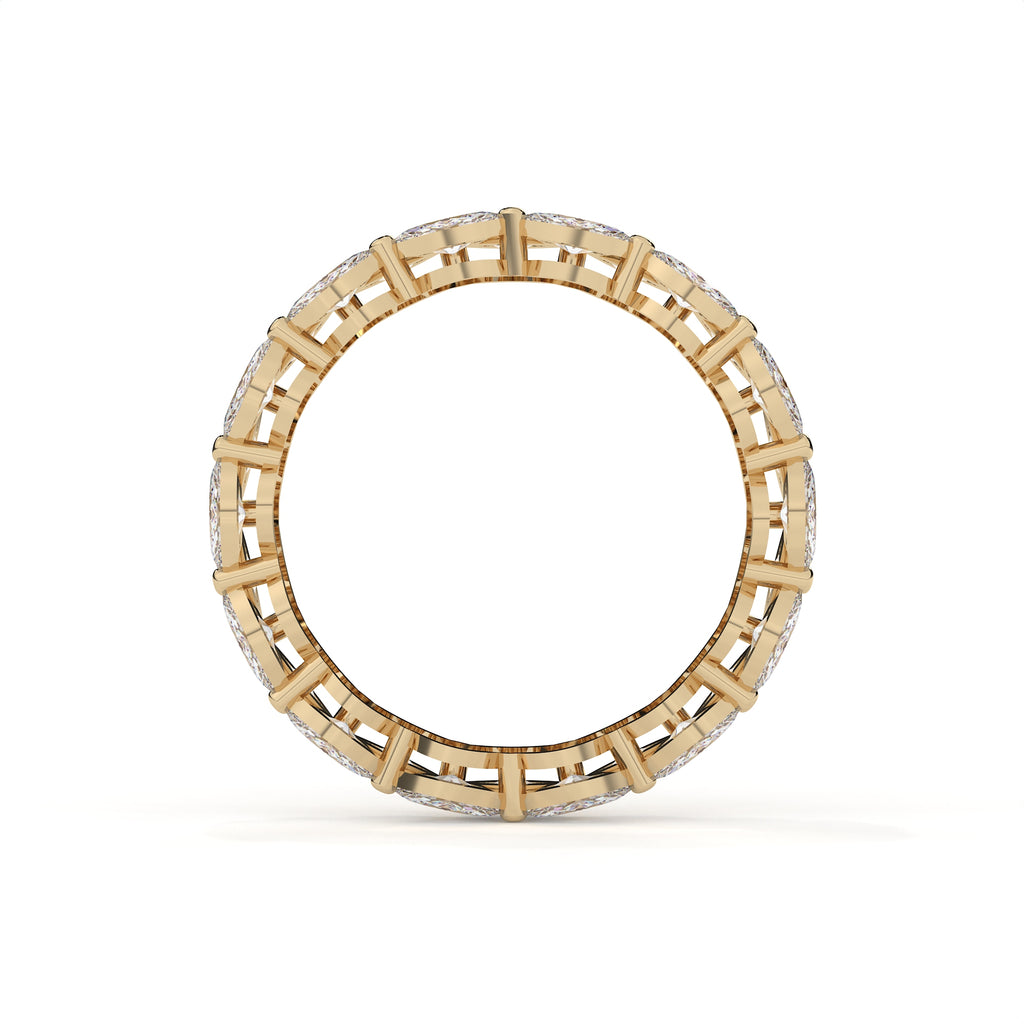 Gold ring with a geometric design on a white background