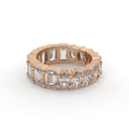 Rose gold ring with diamonds on a white background