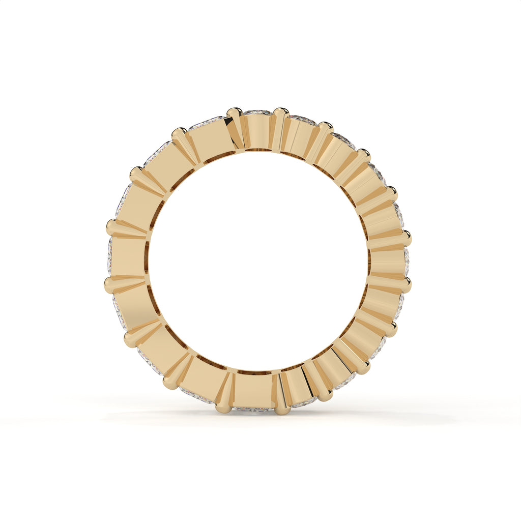 Gold ring with a central gemstone on a white background
