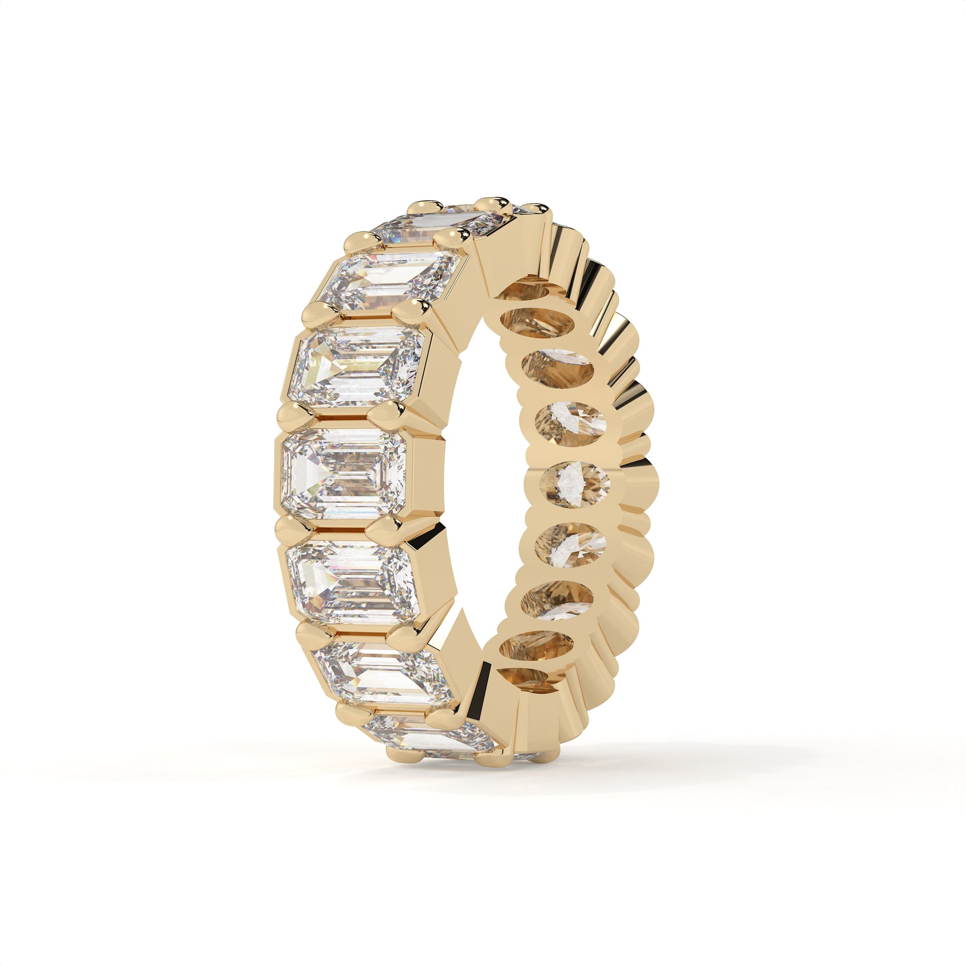 Gold ring with emerald-cut diamonds on a white background