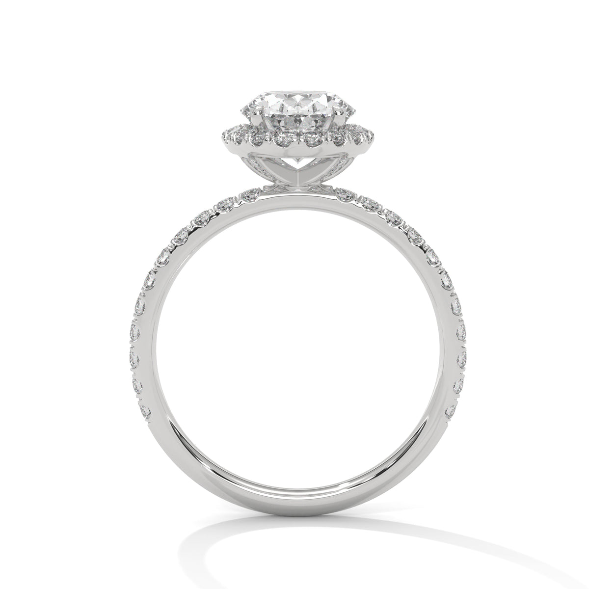 Side profile of an oval cut diamond halo engagement ring in white gold with a pavé diamond band and raised halo setting.