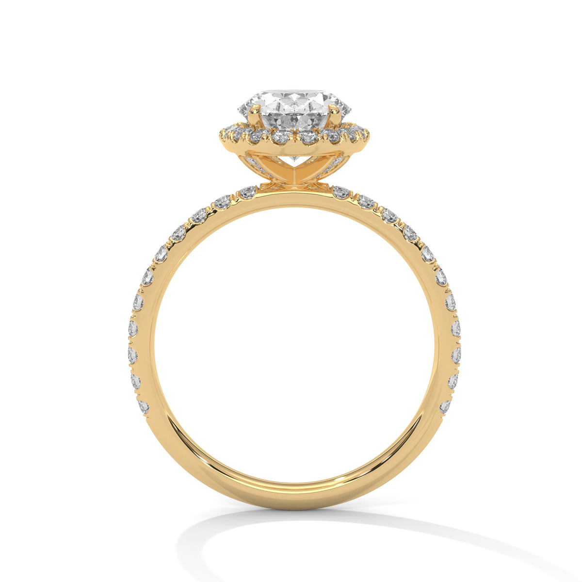 Side profile of an oval cut diamond halo engagement ring in yellow gold with a pavé diamond band and raised halo setting.
