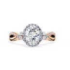 Rose gold and silver diamond ring on a white background