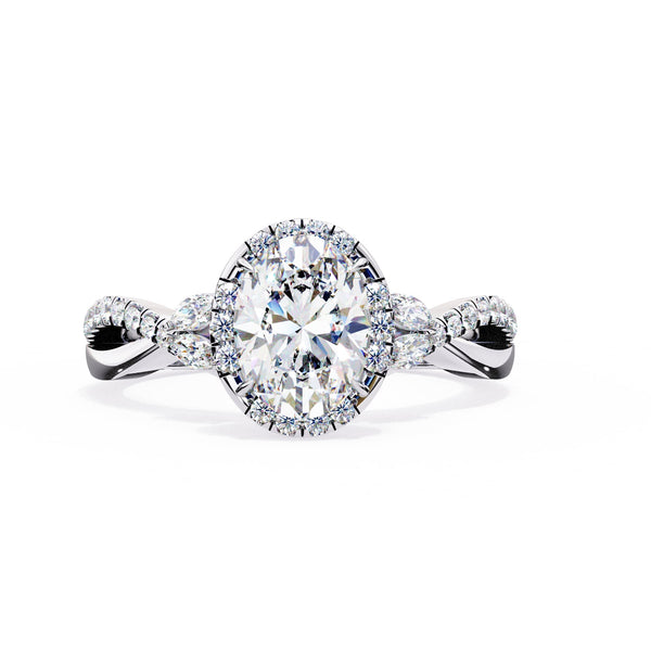 Diamond ring with a pear-shaped center stone on a white background
