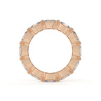 Rose gold ring with diamond accents on a white background