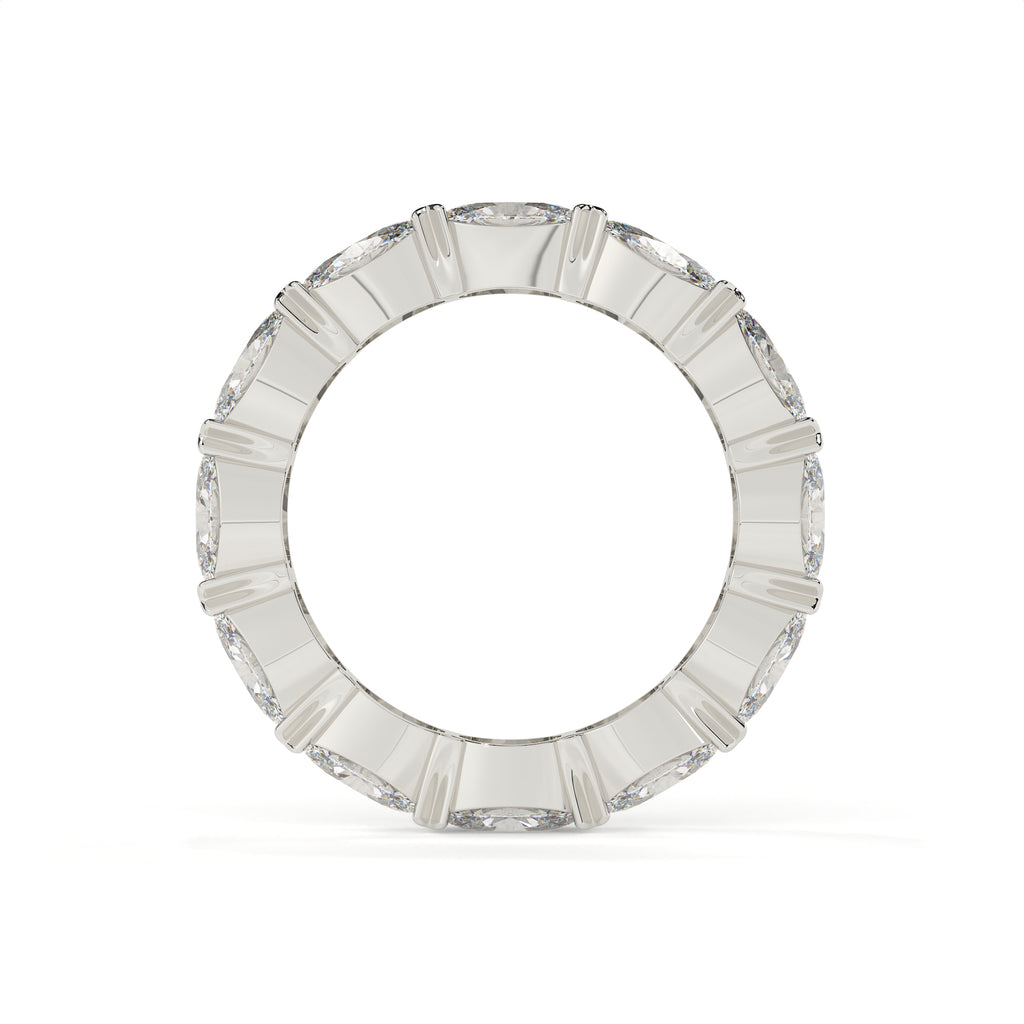 Silver ring with rectangular gemstones on a white background