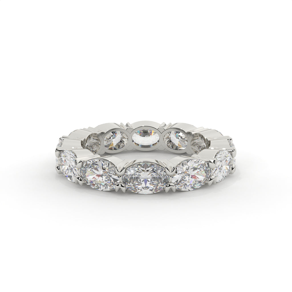 Silver ring with multiple diamonds on a white background