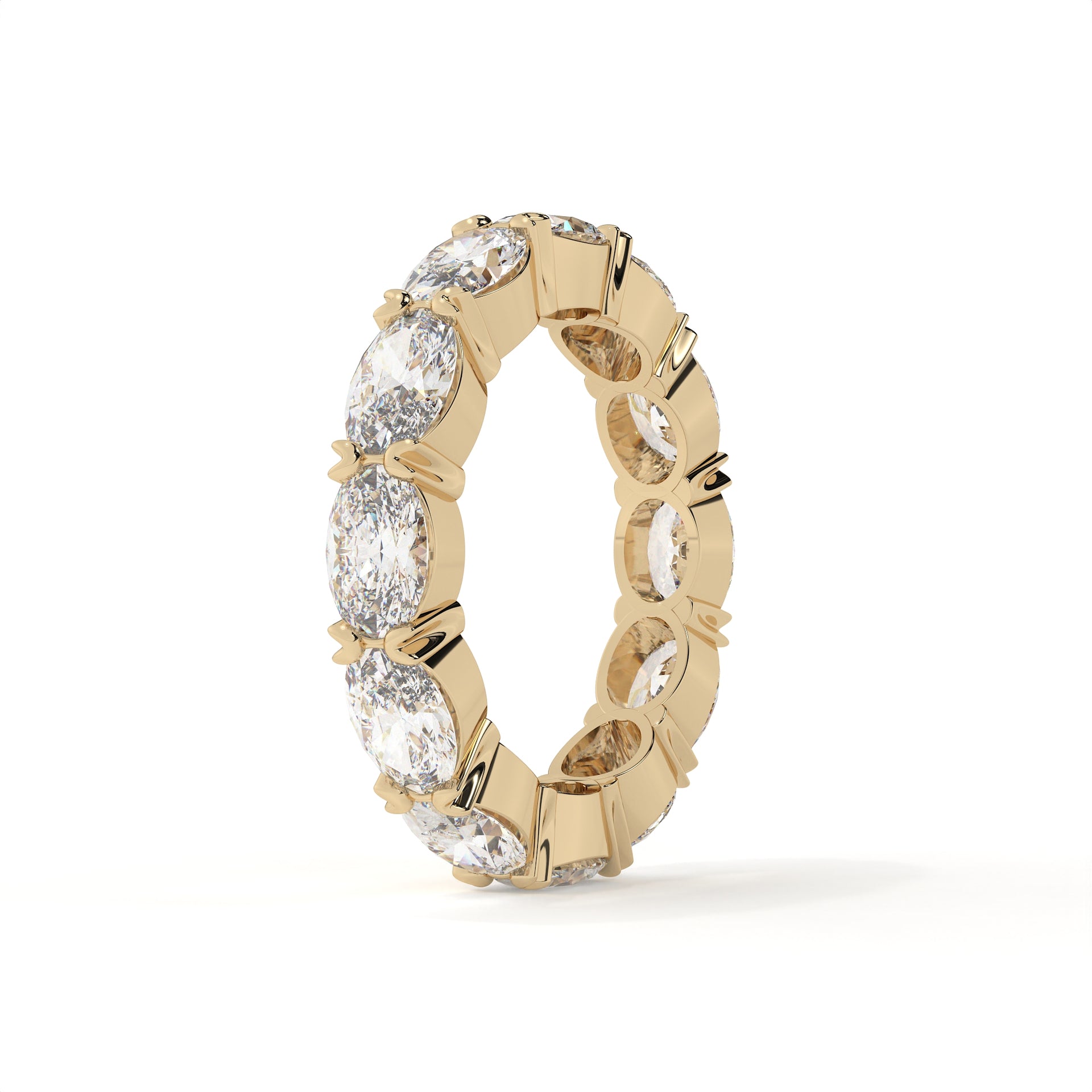 Gold ring with embedded diamonds on a white background
