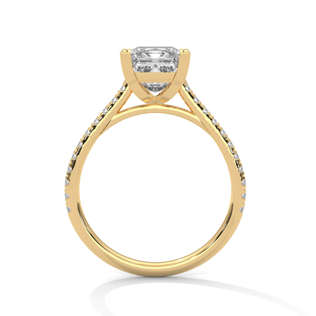 Side profile of a princess cut diamond engagement ring in yellow gold with a pavé diamond band, raised four-prong setting, and open gallery.