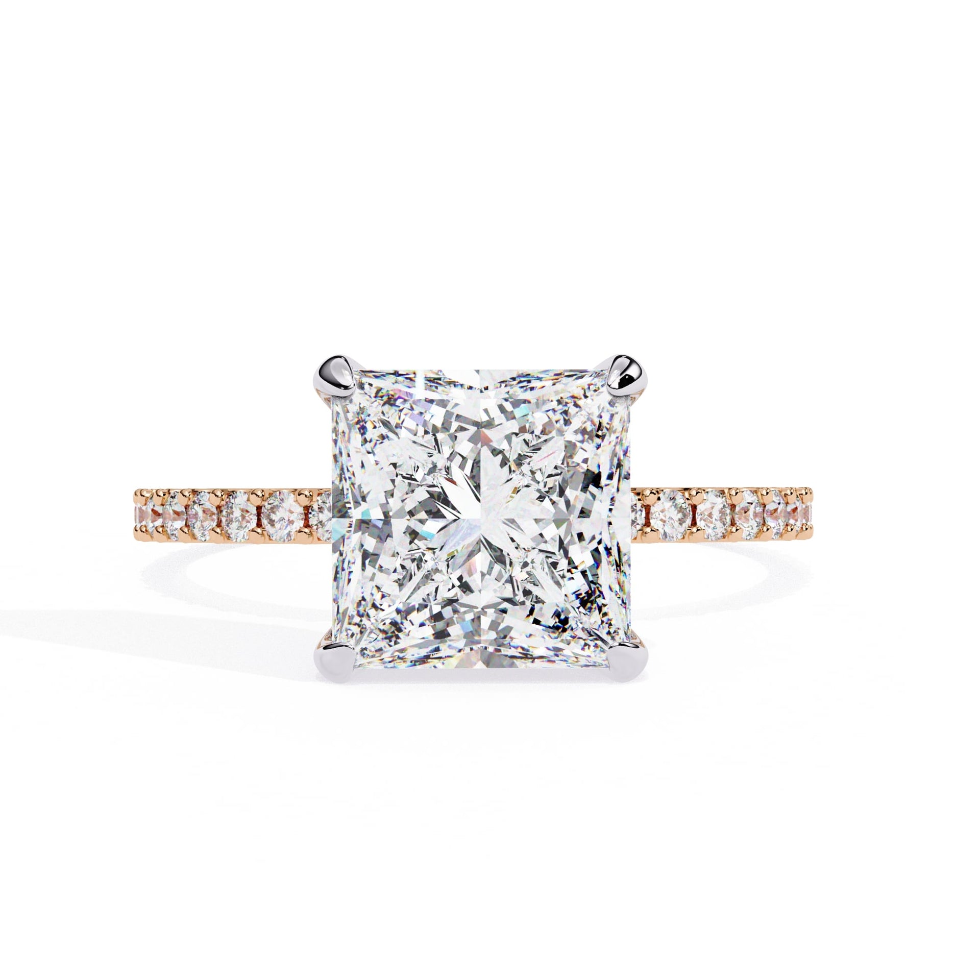 Diamond ring with a square-cut center stone on a white background
