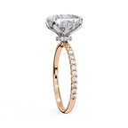 Rose gold ring with a diamond on a white background