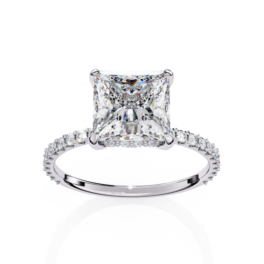 Diamond ring with a prominent princess-cut diamond on a white background