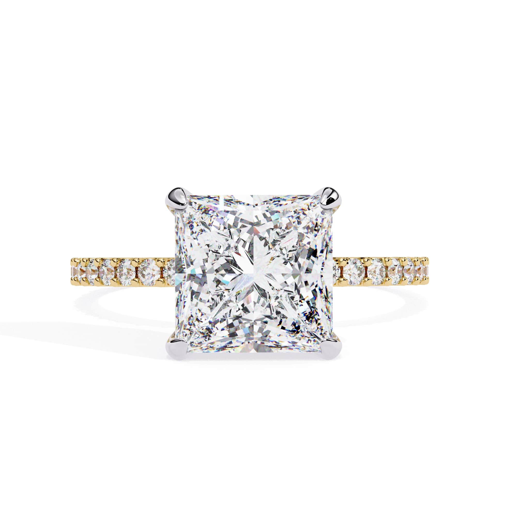 Diamond ring with a yellow gold band on a white background