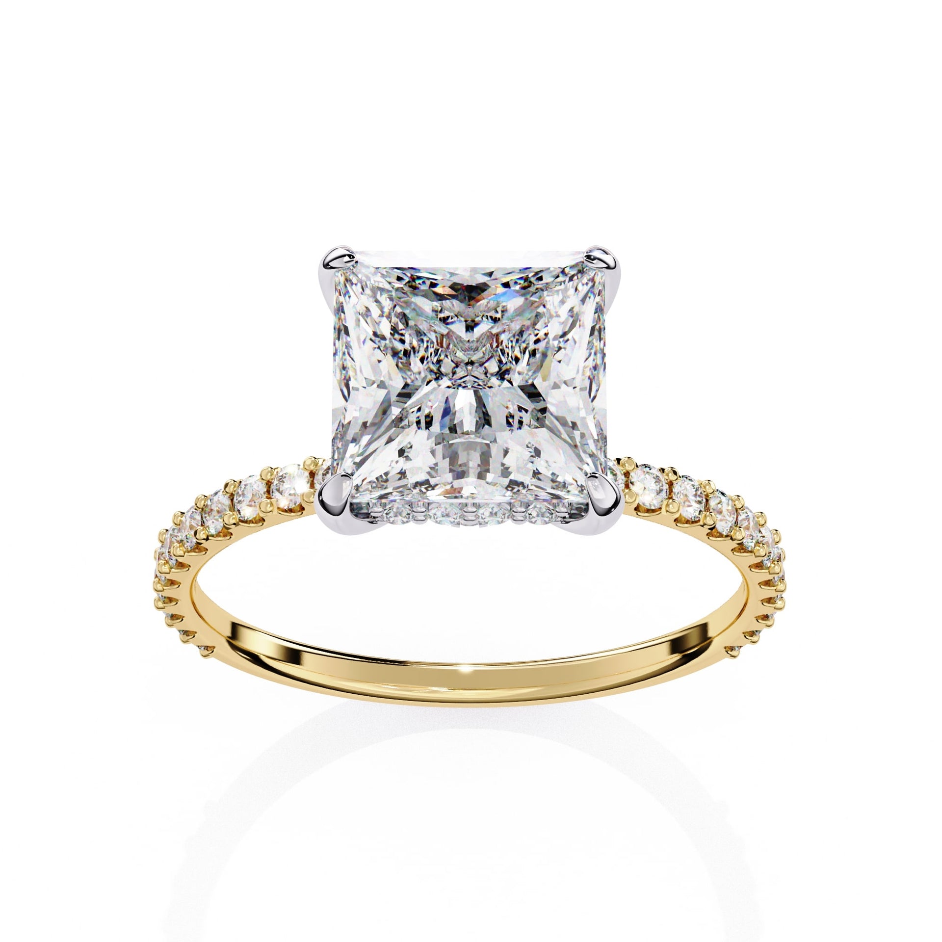 Gold ring with a large diamond and smaller diamonds on the band against a white background