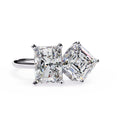 Pair of diamond stud earrings on a white background