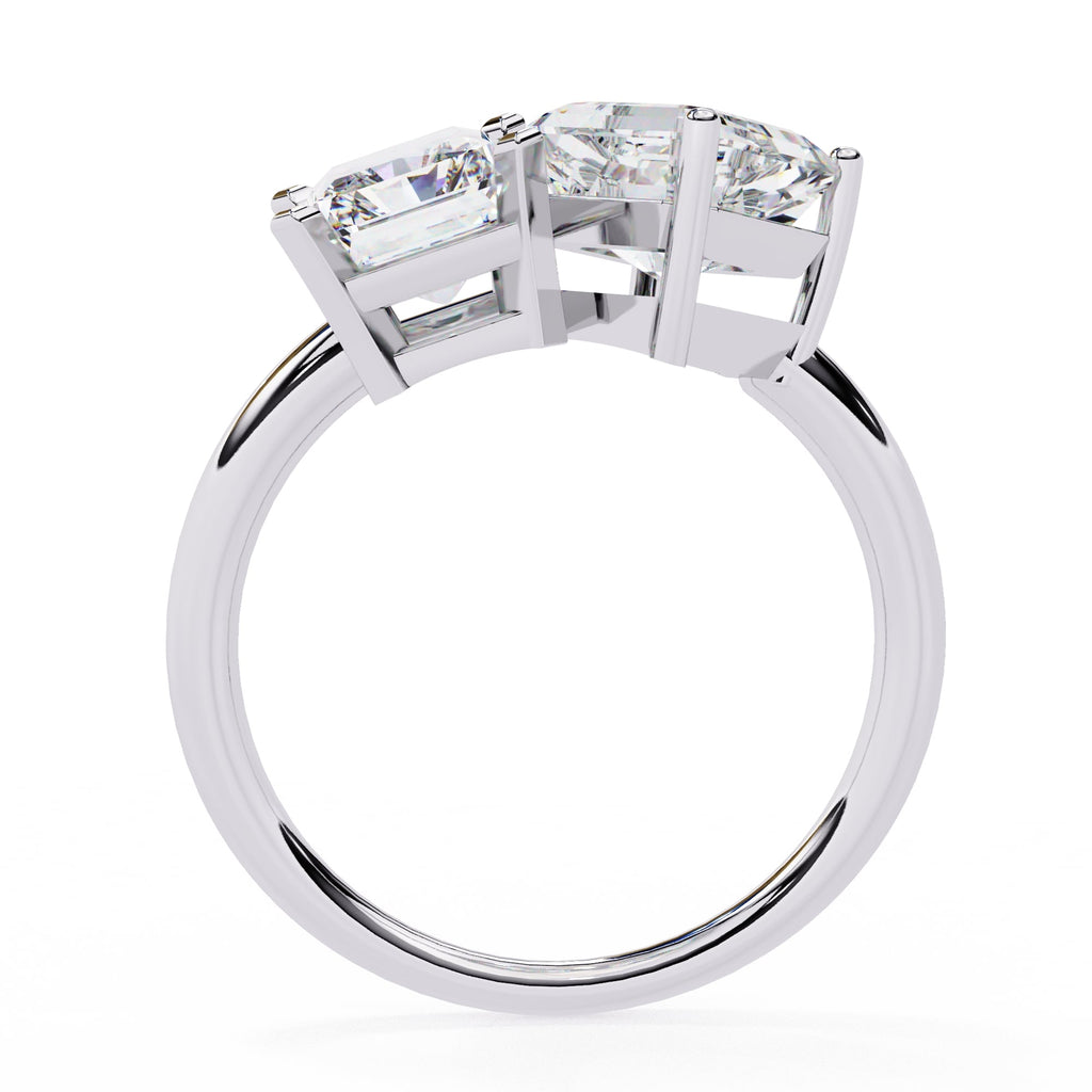 Diamond ring with three clear gemstones on a white background