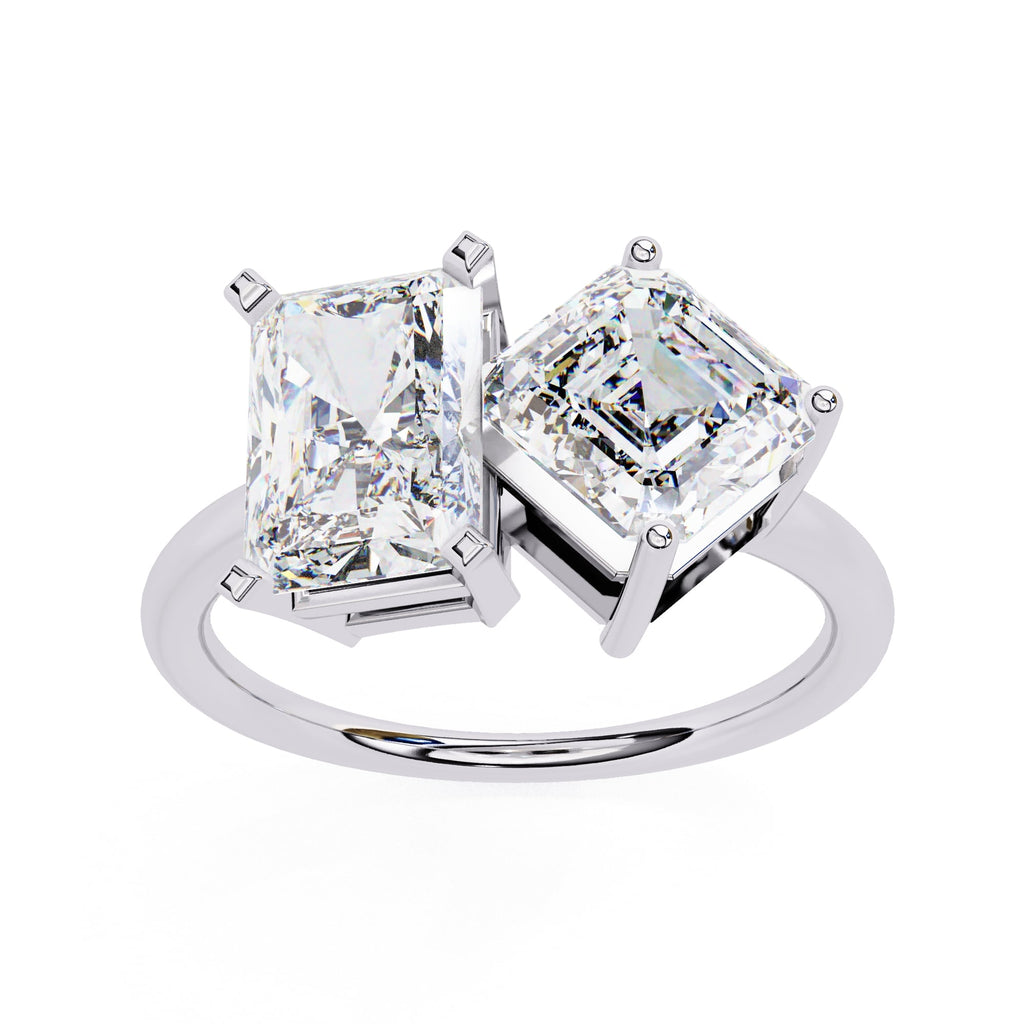 Diamond ring with two large square-cut diamonds on a white background