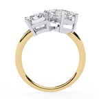 Gold ring with a diamond on a white background
