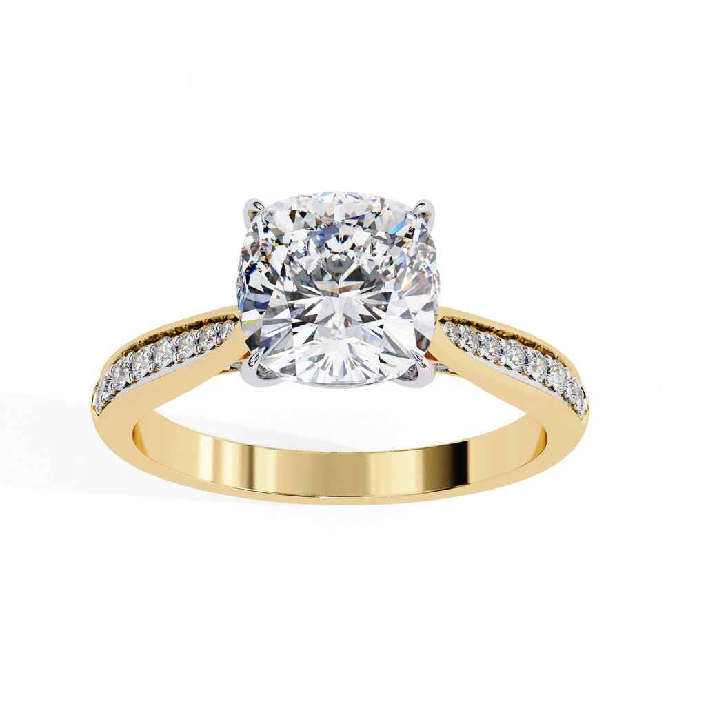 Gold ring with a large diamond and smaller diamonds on the band against a white background