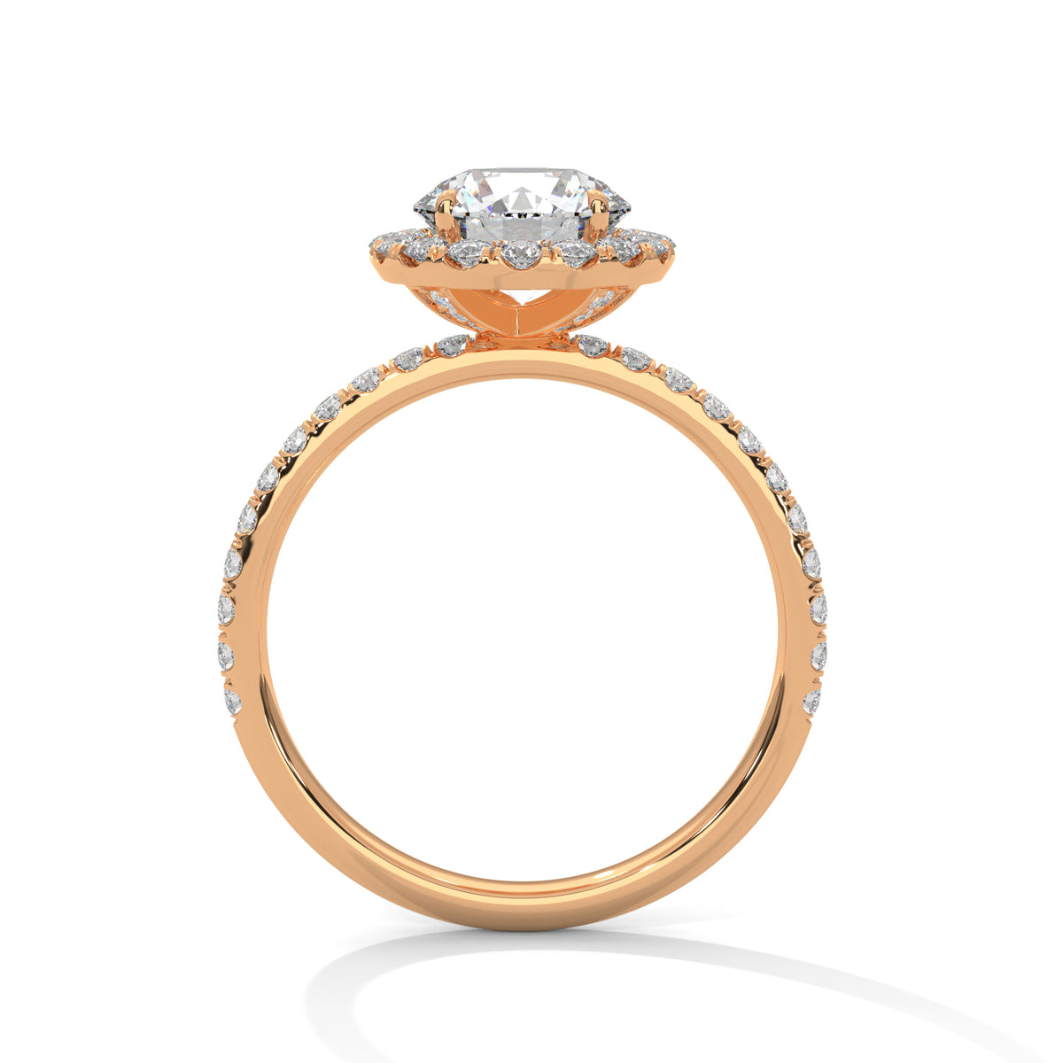 Side profile of a round cut diamond halo engagement ring in rose gold with a pavé diamond band and raised halo setting.