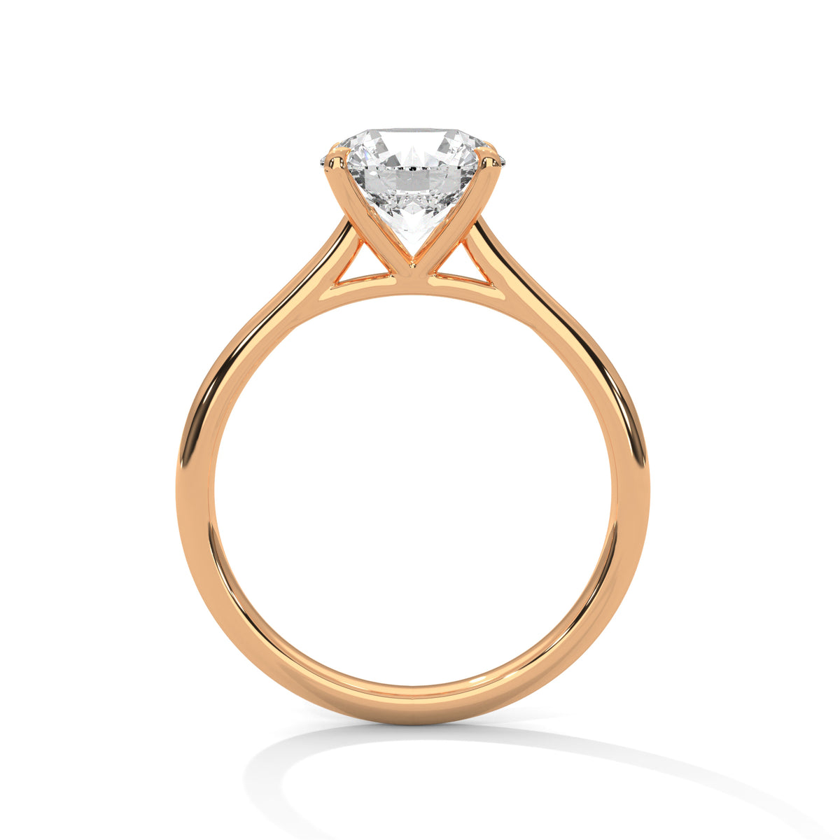Side profile of a round cut diamond solitaire engagement ring in rose gold with a raised four-prong setting and open gallery.