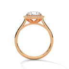 Side profile of a round cut diamond halo engagement ring in rose gold with an open gallery setting.