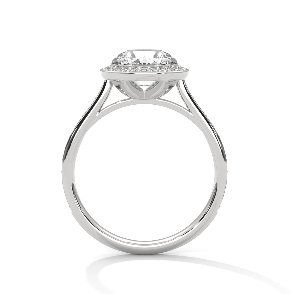Side profile of a round cut diamond halo engagement ring in white gold with an open gallery setting.