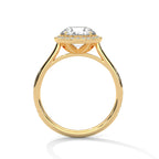 Side profile of a round cut diamond halo engagement ring in yellow gold with an open gallery setting.