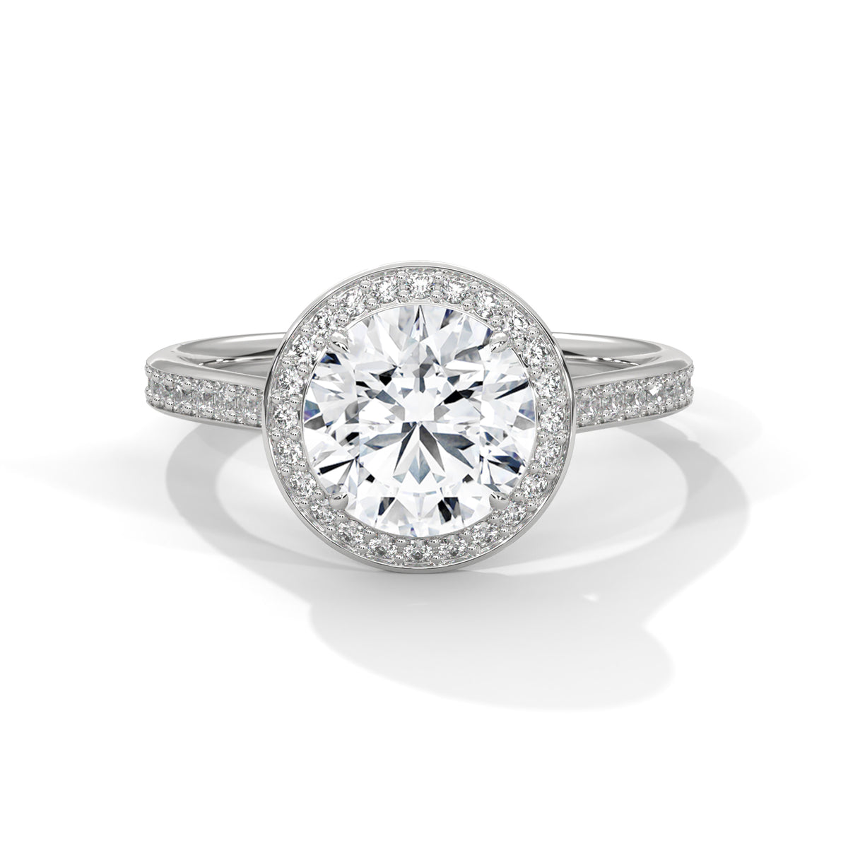 Round cut diamond halo engagement ring in white gold with a pave diamond band, shown in a front product view.