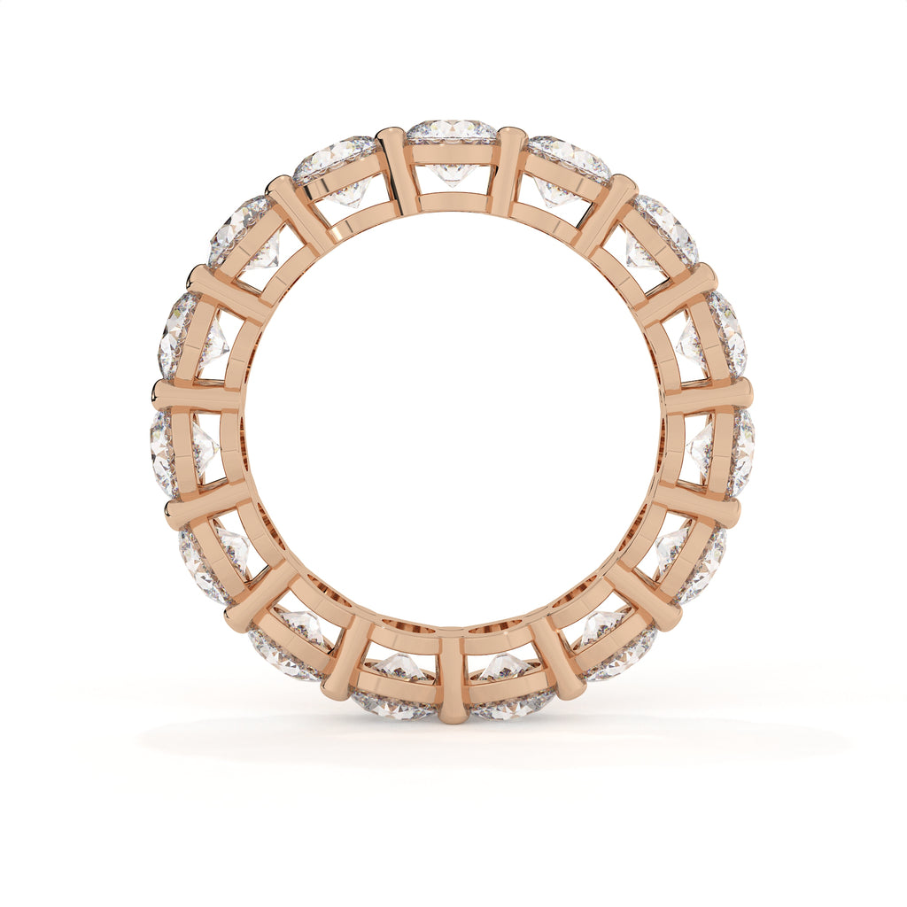 Rose gold ring with diamond accents on a white background