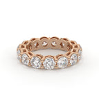 Rose gold ring with diamonds on a white background