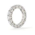 Diamond ring with a white gold band on a white background