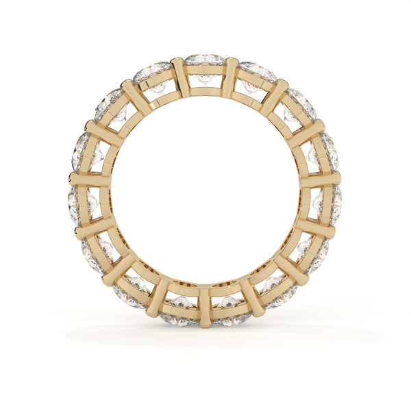 Gold ring with diamond accents on a white background