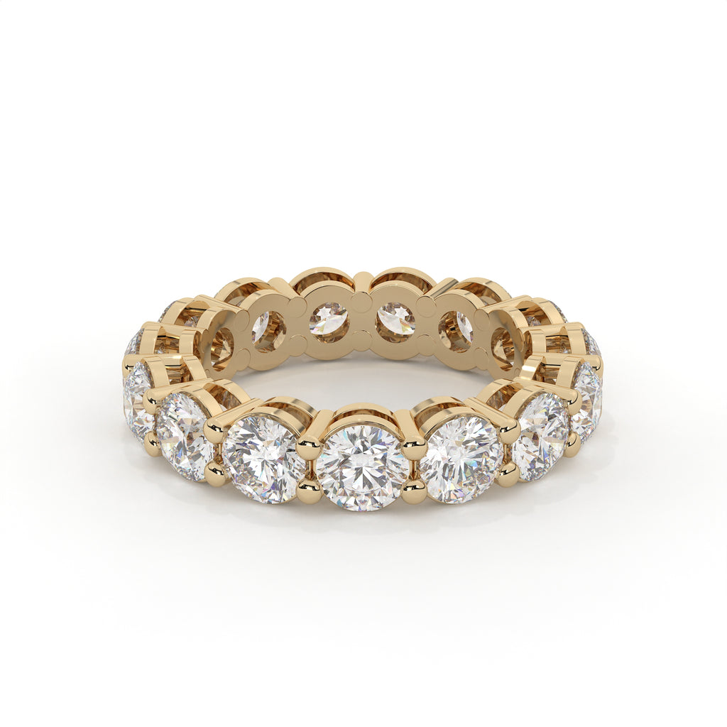 Gold ring with diamonds on a white background